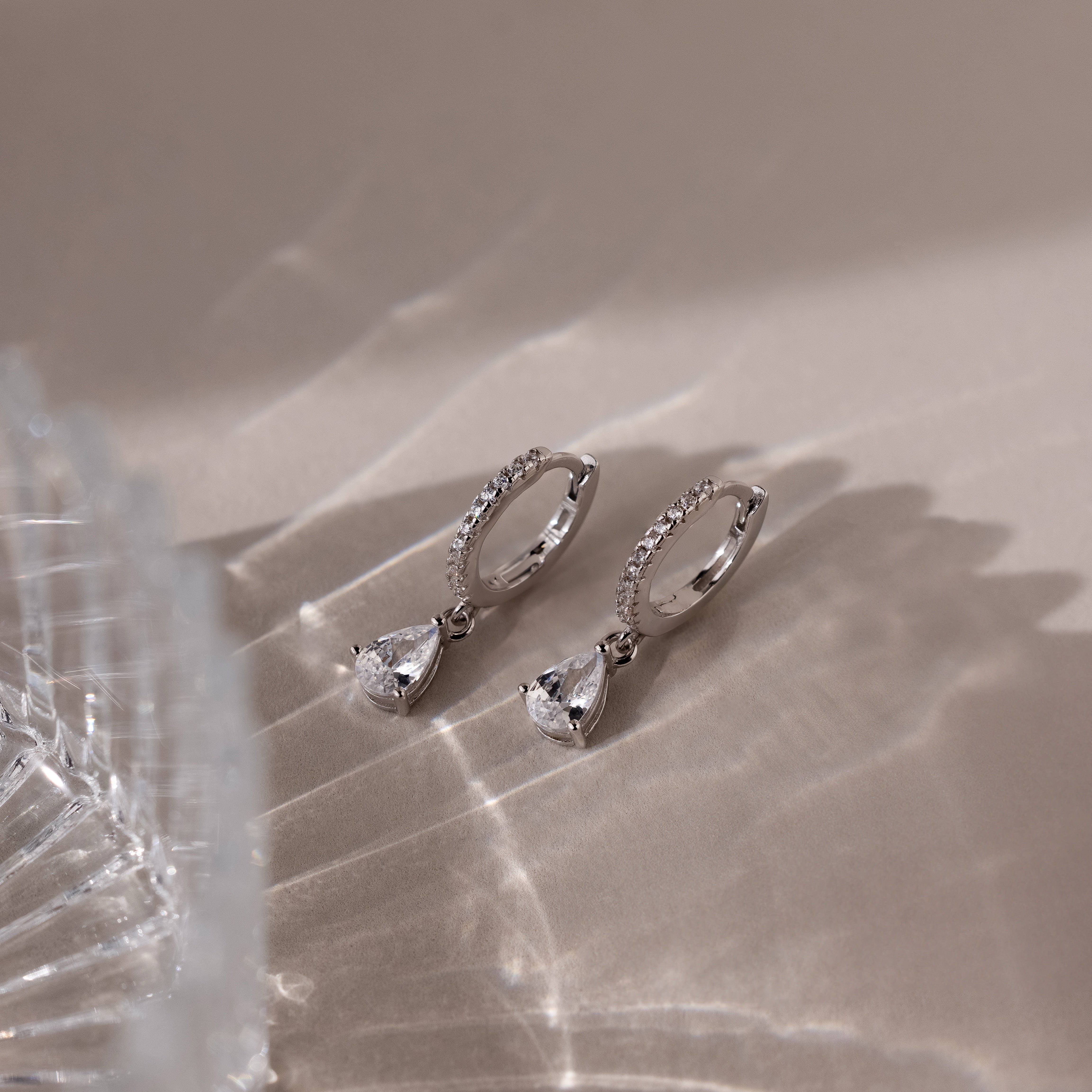 Diamond Drop Huggies in Silver - Image 3