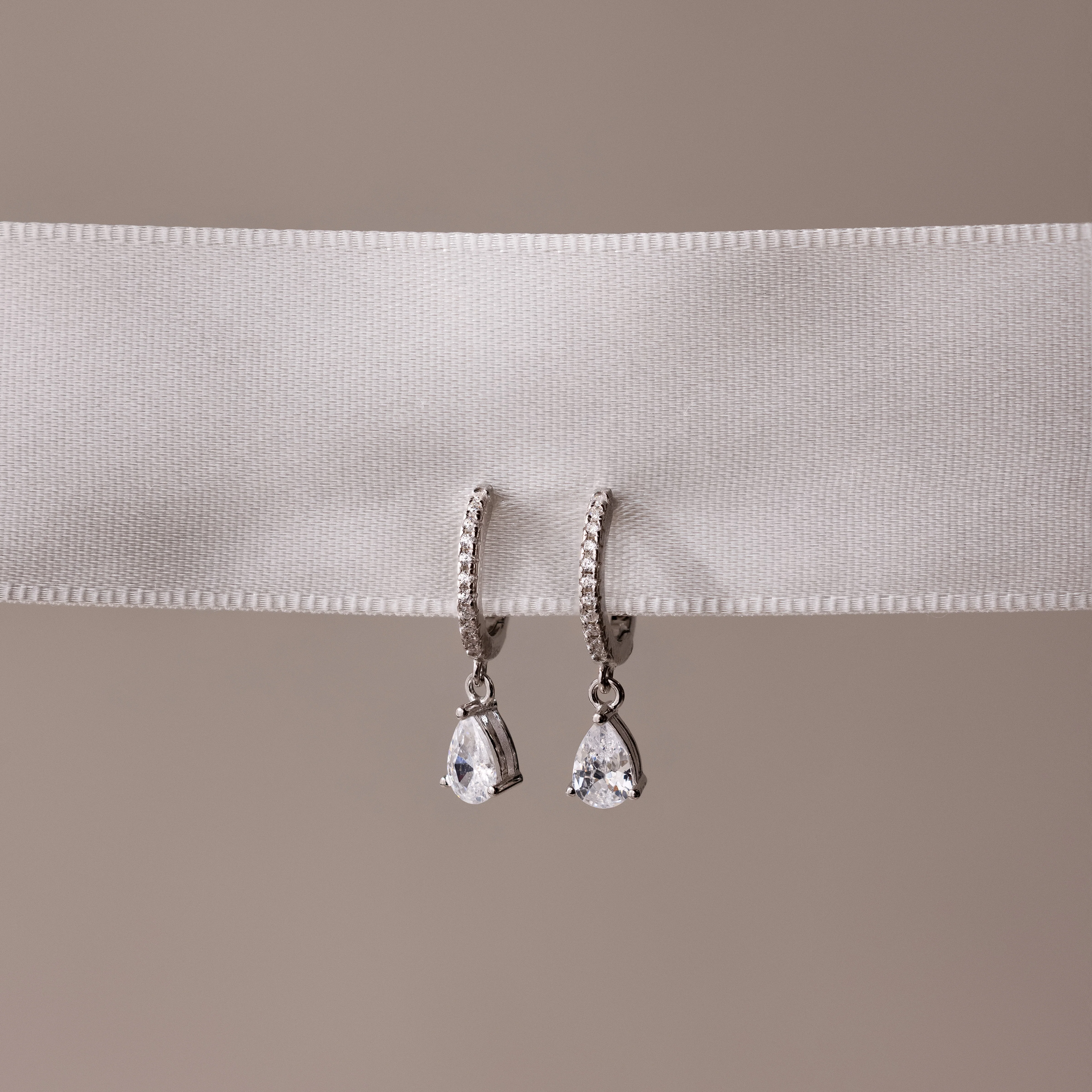 Diamond Drop Huggies in Silver - Image 7